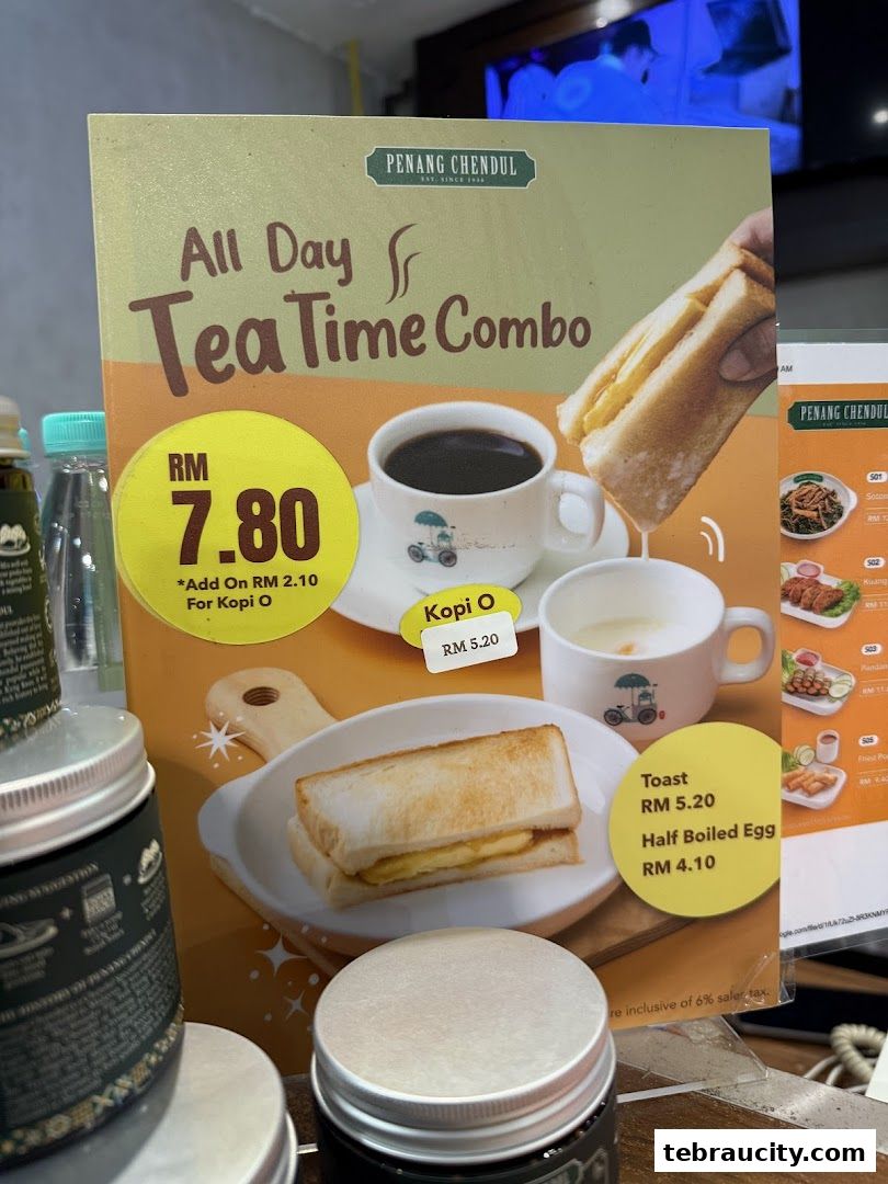 A menu board for Penang Road Famous Teochew Chendul, showcasing a tea time combo with toast and coffee.