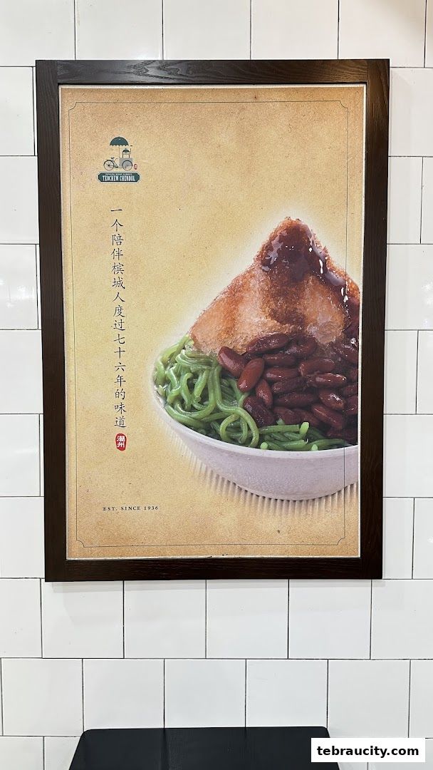 A framed poster of Penang Road Famous Teochew Chendul dessert with green noodles and red beans.