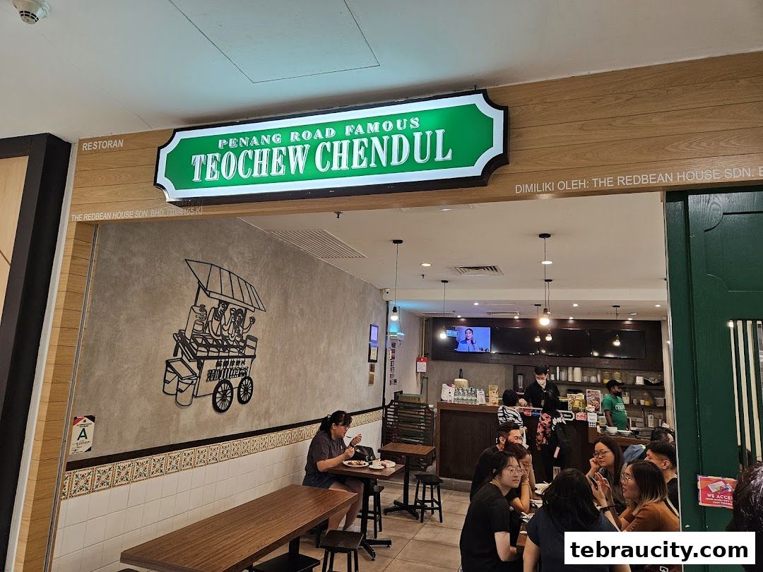 Interior view of Penang Road Famous Teochew Chendul restaurant with customers dining and staff serving.