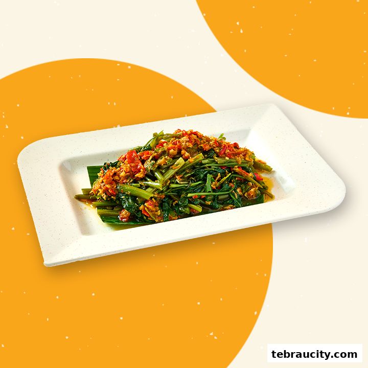 A plate of stir-fried kangkung with chili and spices, presented on a white rectangular plate.
