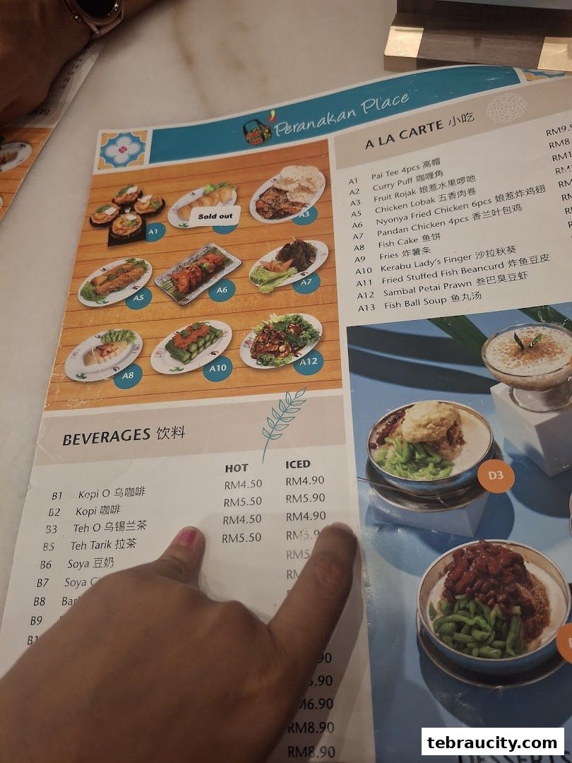 A menu from Peranakan Place featuring a la carte dishes and beverages with prices.