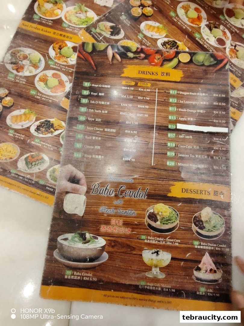 A menu featuring Peranakan dishes, drinks, and desserts with colorful food photography.