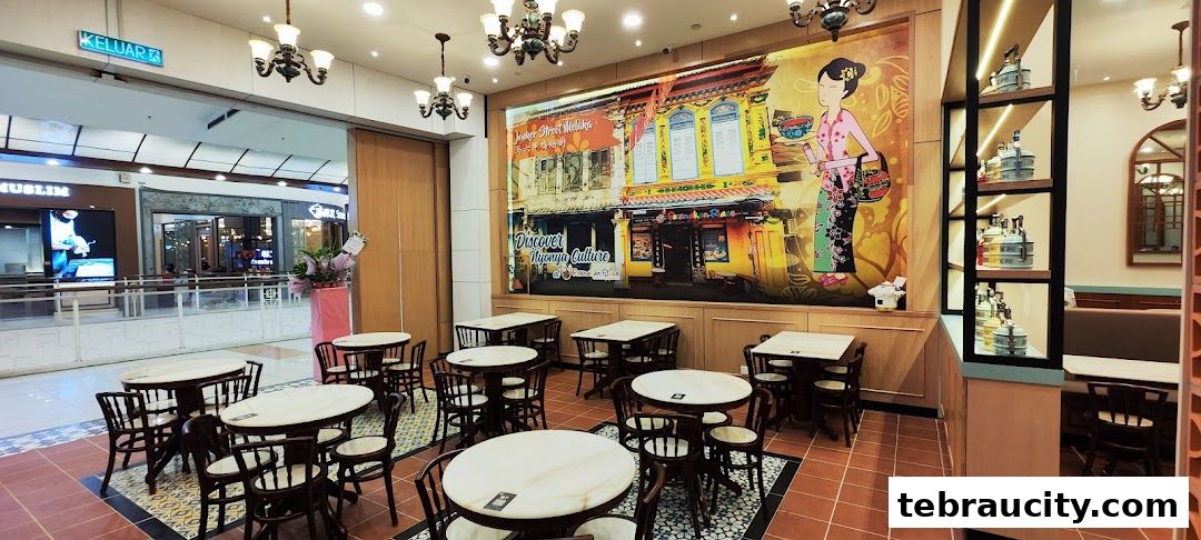 Interior of Peranakan Place restaurant with tables, chairs, and a large mural.