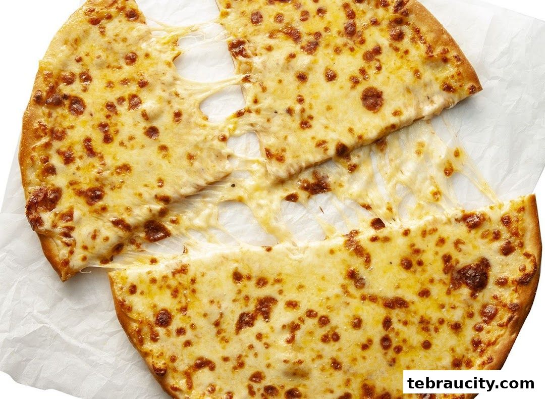 A close-up shot of a cheesy pizza with melted cheese stretching between slices.