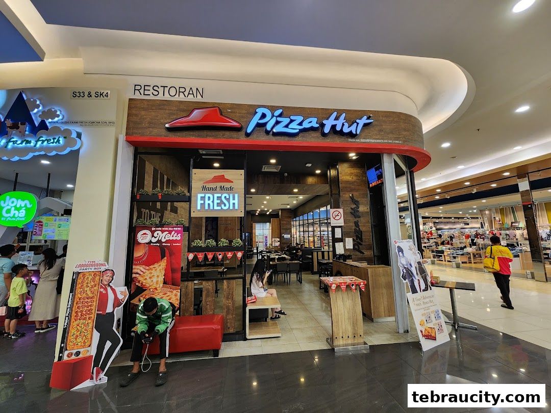 The exterior of a Pizza Hut restaurant with its iconic logo and signage.