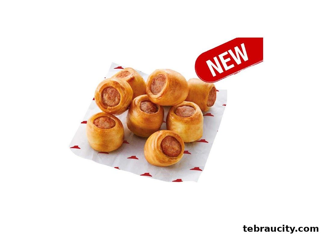 A serving of new sausage rolls from Pizza Hut on branded paper.
