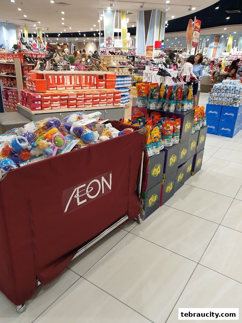 A retail store interior displaying shoes, toys, and packaged goods on shelves and displays.