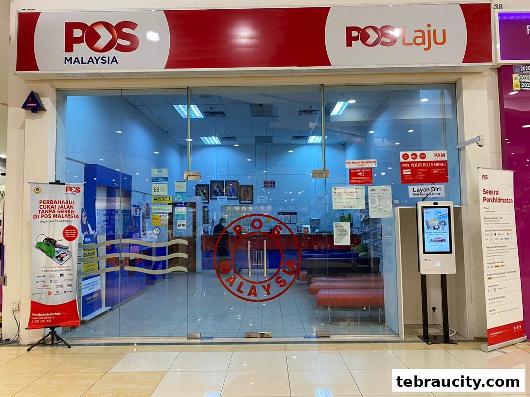 The exterior of a Pos Malaysia and Pos Laju shop with signage and a self-service kiosk.