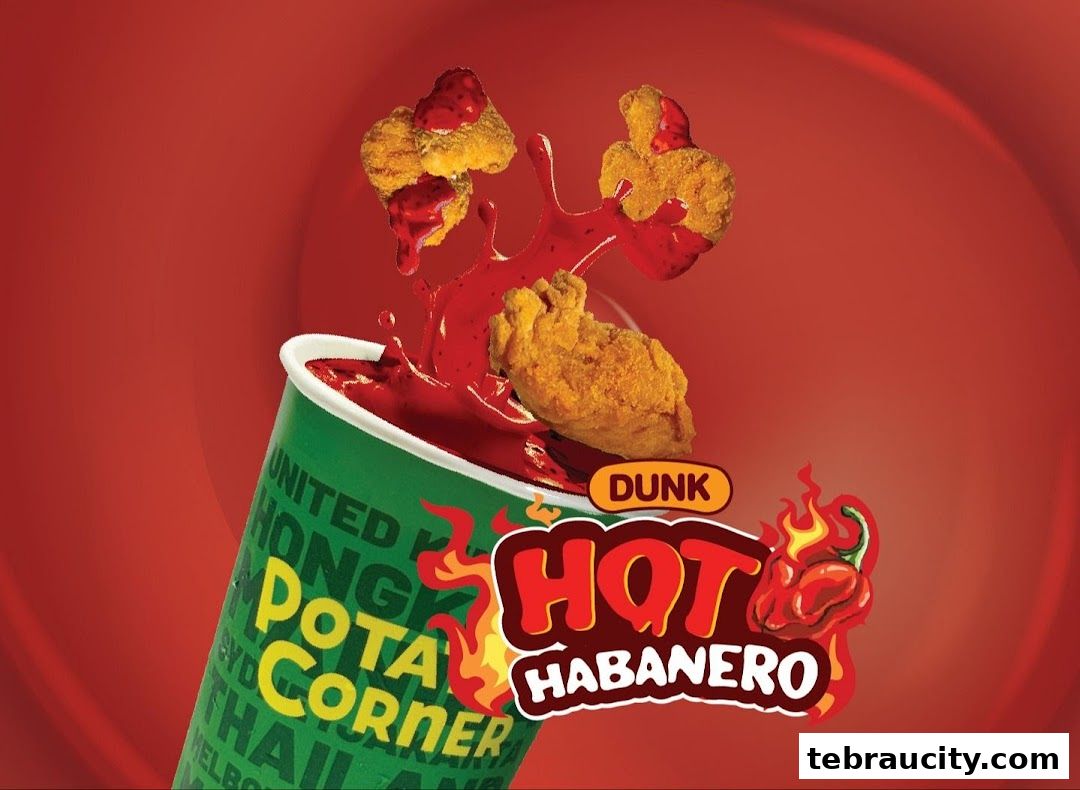 Potato Corner Hot Habanero flavor with crispy chicken pieces being dunked into sauce.