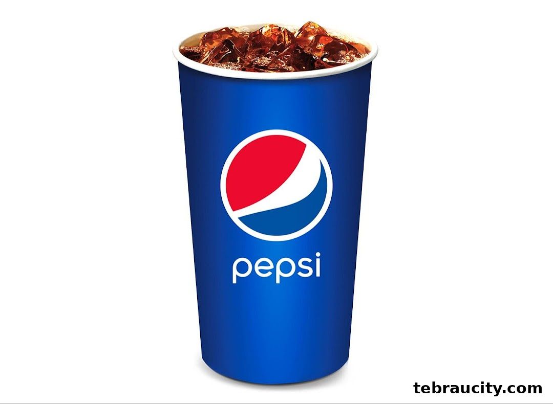 A tall cup of Pepsi with ice and condensation, against a white background.