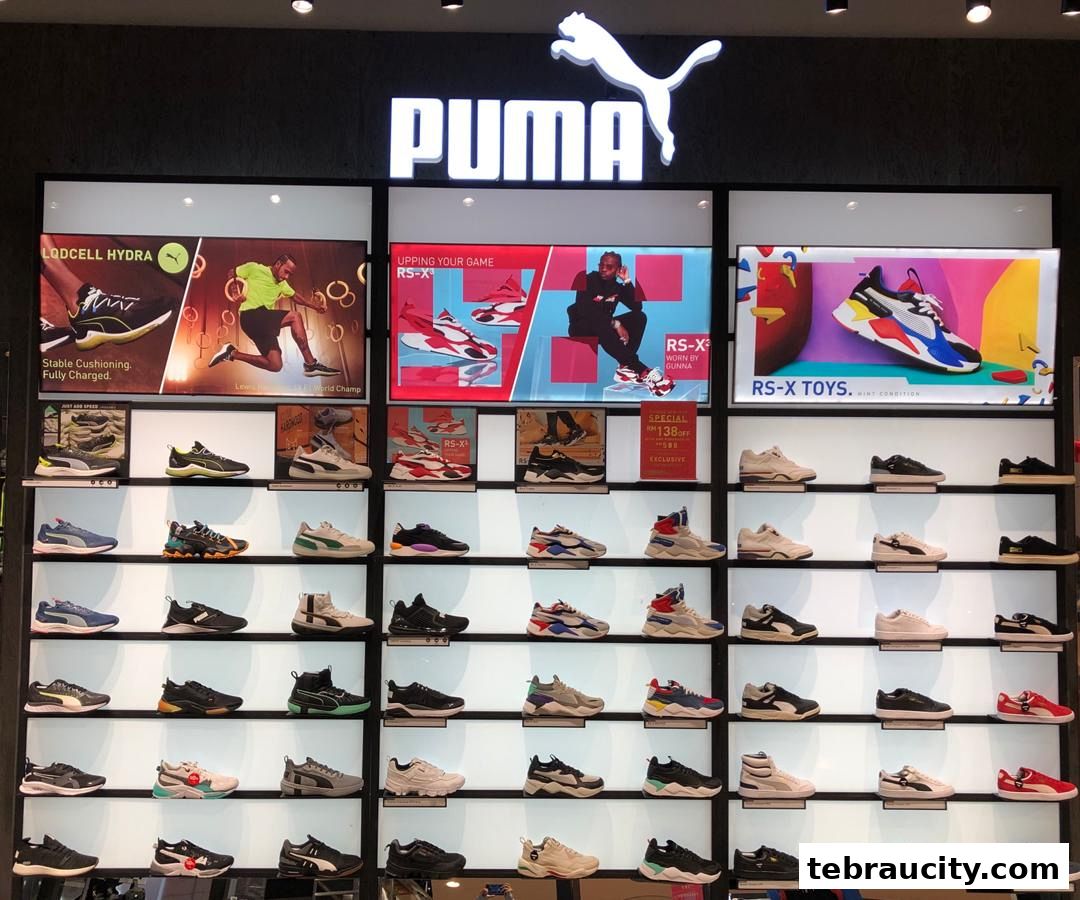A well-lit display of Puma shoes, featuring various models and promotional graphics.