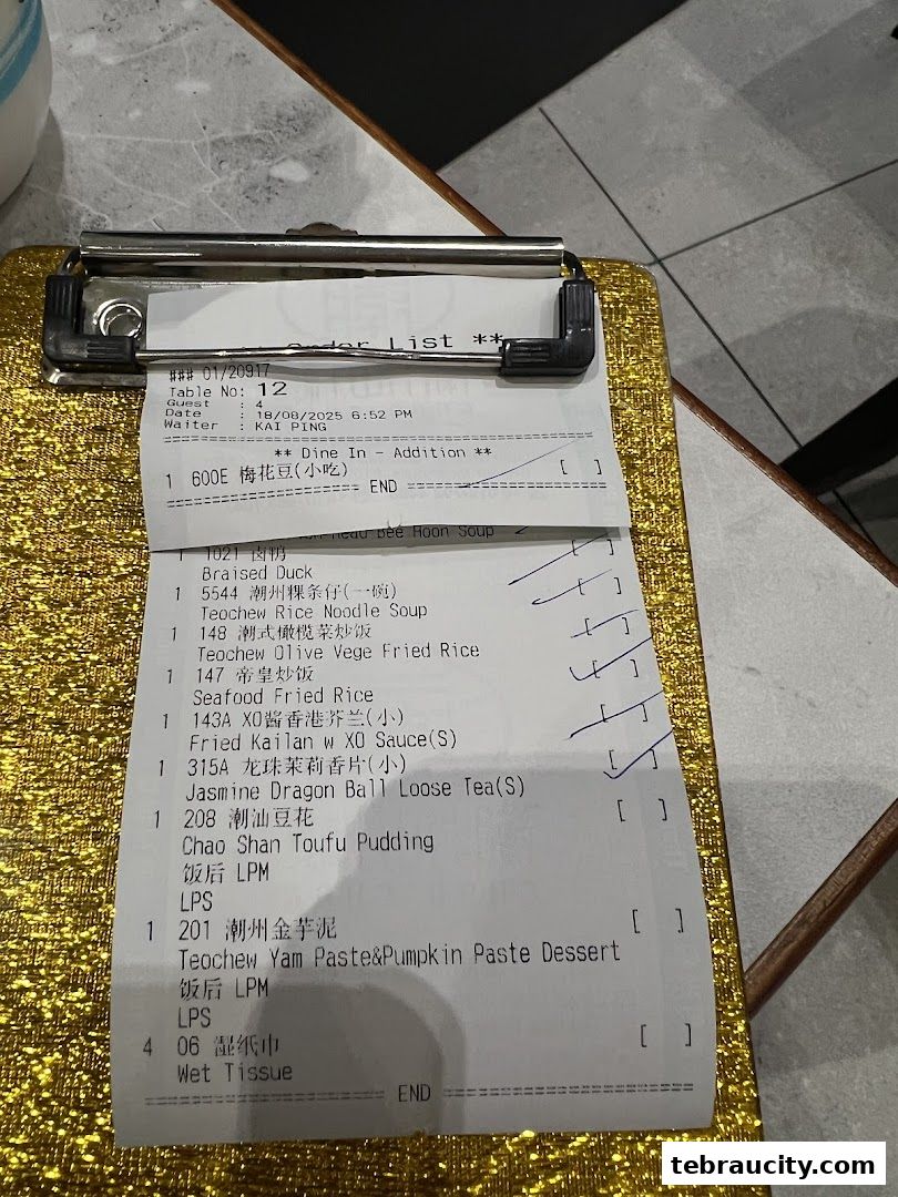 A close-up of a restaurant order list with various Chinese dishes and drinks.