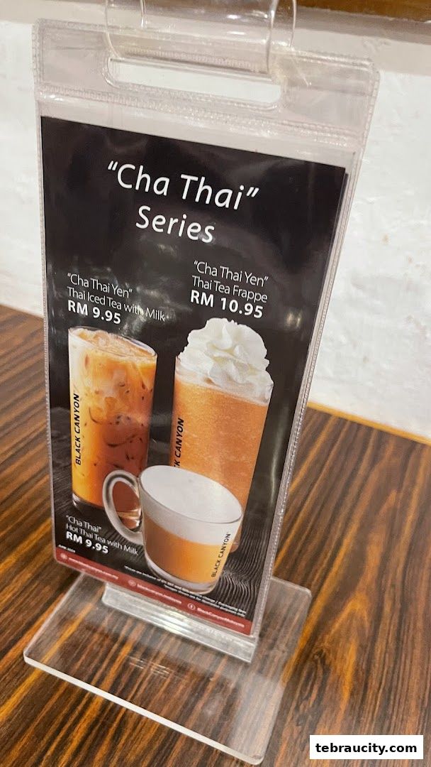 A menu display featuring the "Cha Thai" series drinks from Black Canyon.