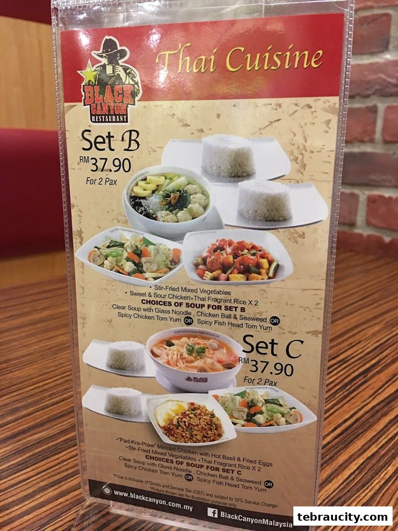 A menu from Restoran Black Canyon featuring Thai Cuisine set meals for two.