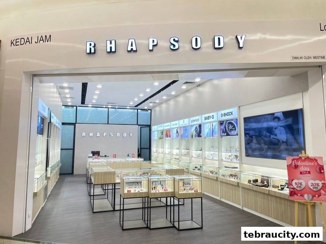 Interior view of a Rhapsody watch store showcasing display cases filled with watches.