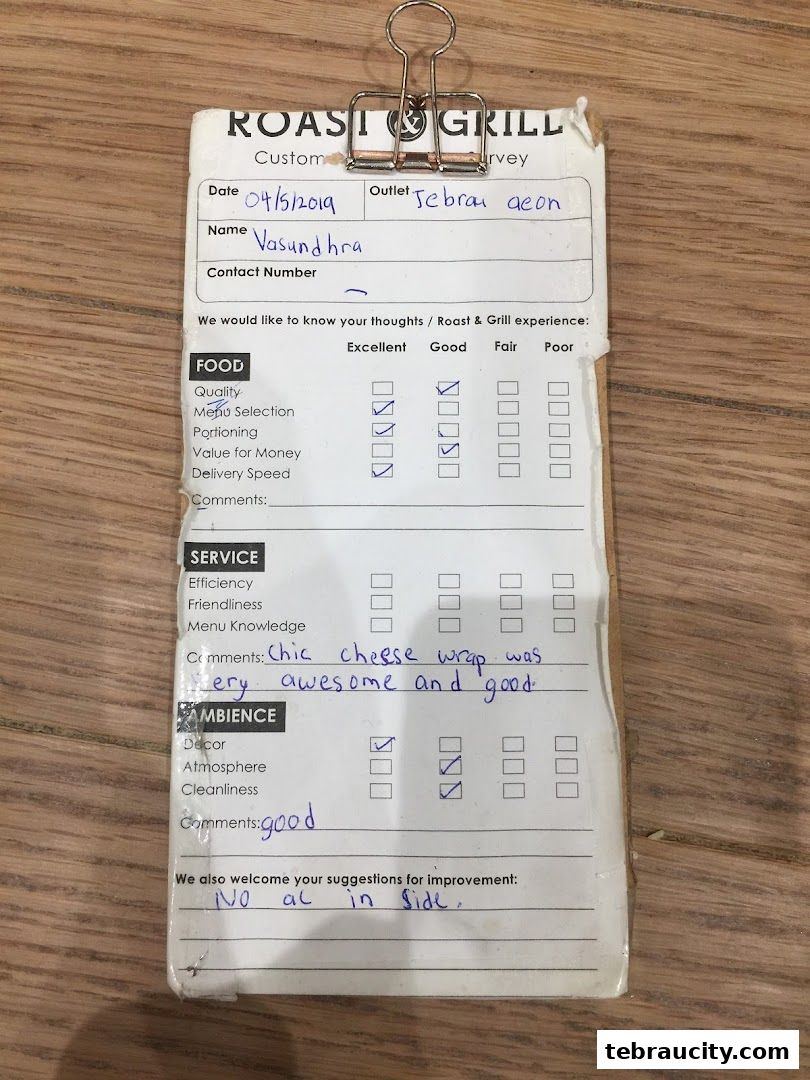 A customer feedback form for Roast & Grill with handwritten responses.