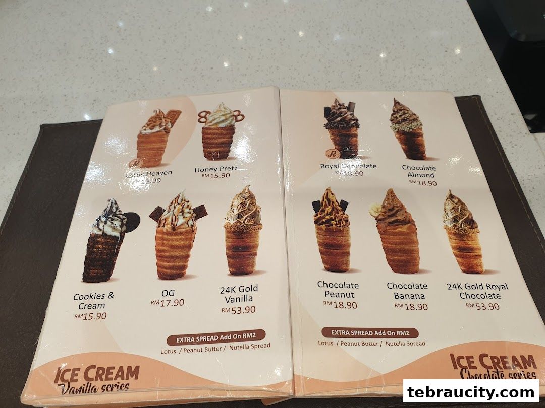 A menu showcasing various ice cream cone flavors and prices from Rollney Aeon Tebrau.