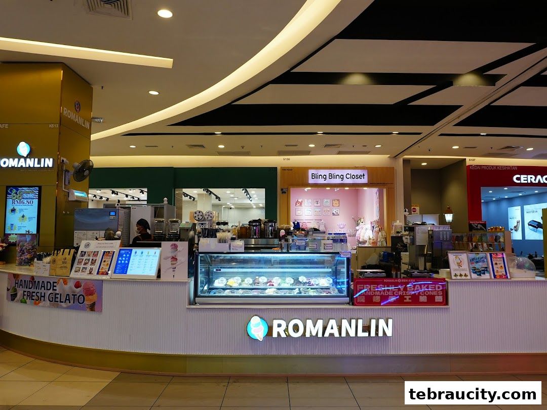 A Romanlin ice cream and tea shop with a display of gelato and freshly baked cones.