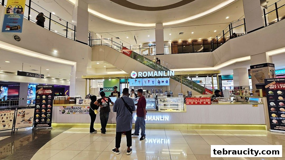 A Romanlin ice cream and tea shop counter with customers ordering.