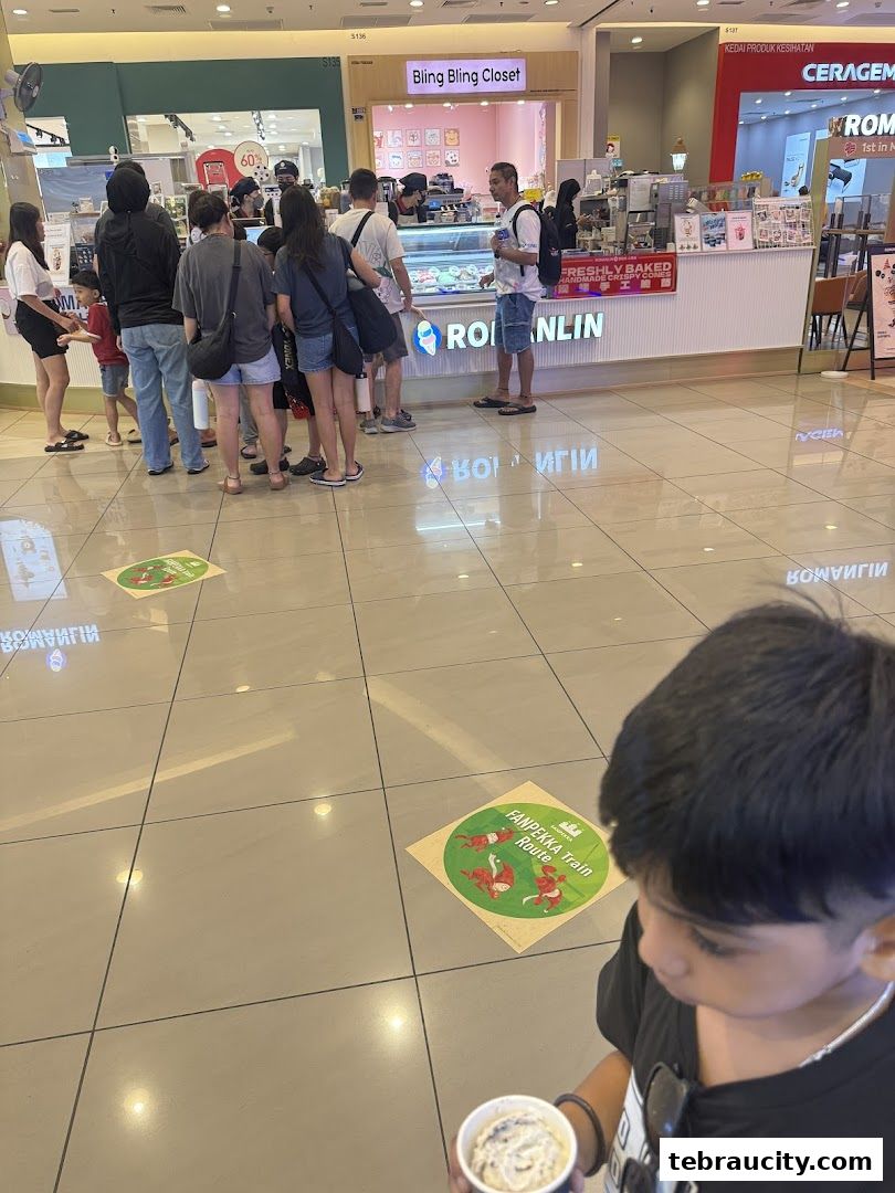 Customers queue at Romanlin ice cream and tea shop in Aeon Mall Tebrau City.