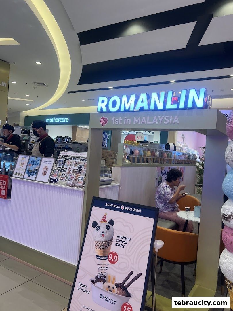 A Romanlin ice cream and tea shop with a prominent sign and display of ice cream cones.