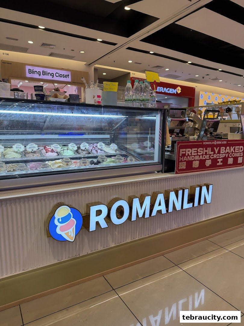 A Romanlin ice cream and tea shop with a display of colorful ice cream flavors.