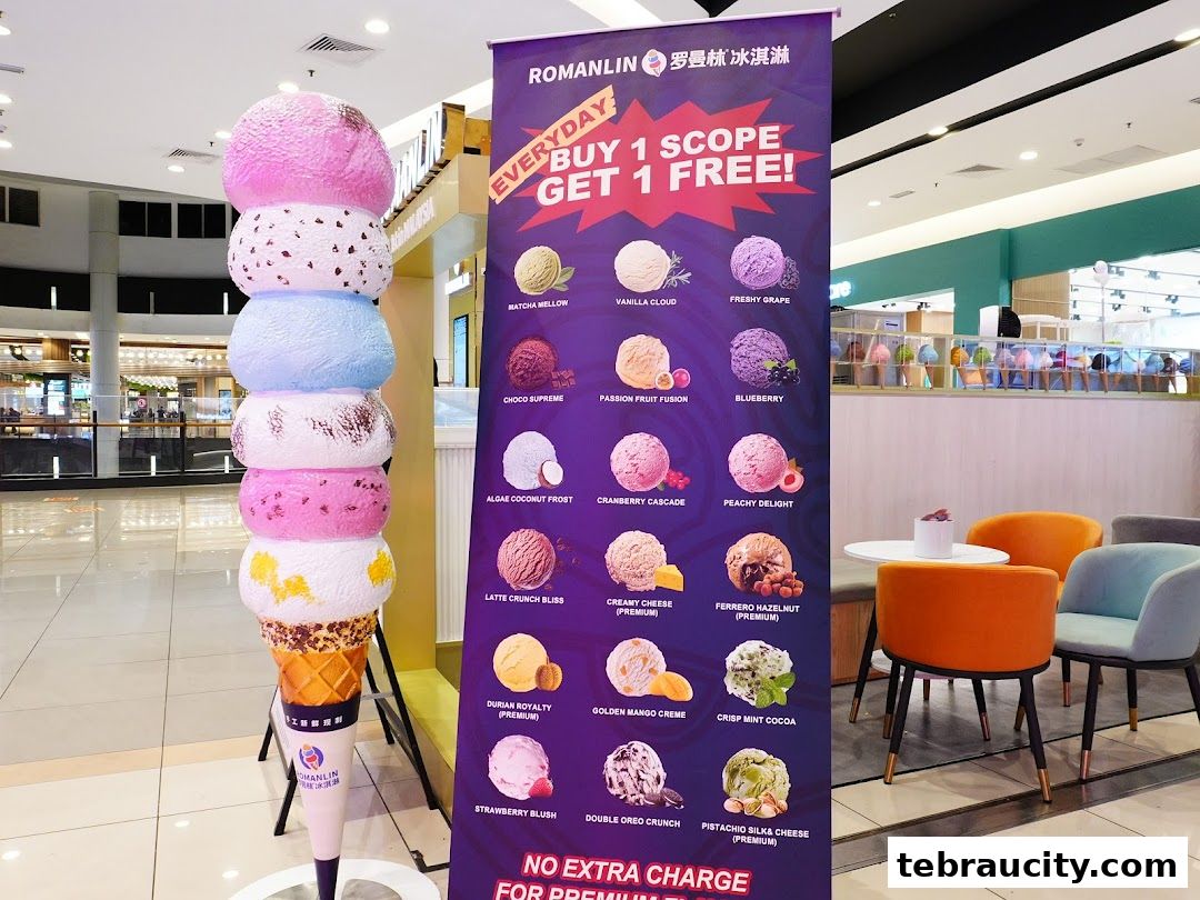 A large ice cream cone sculpture and a promotional banner for Romanlin ice cream.