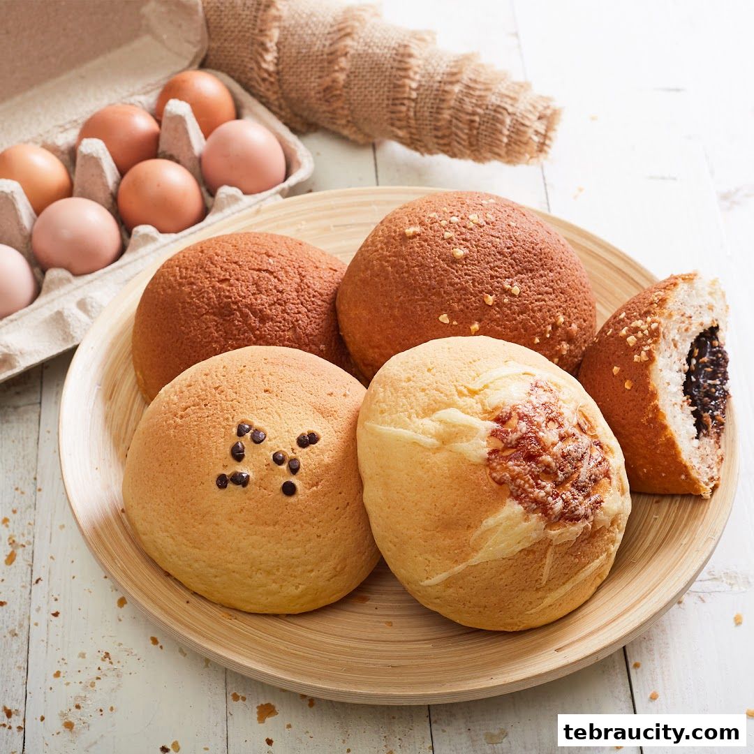 A close-up shot of freshly baked Rotiboy buns with chocolate chips and cheese toppings.