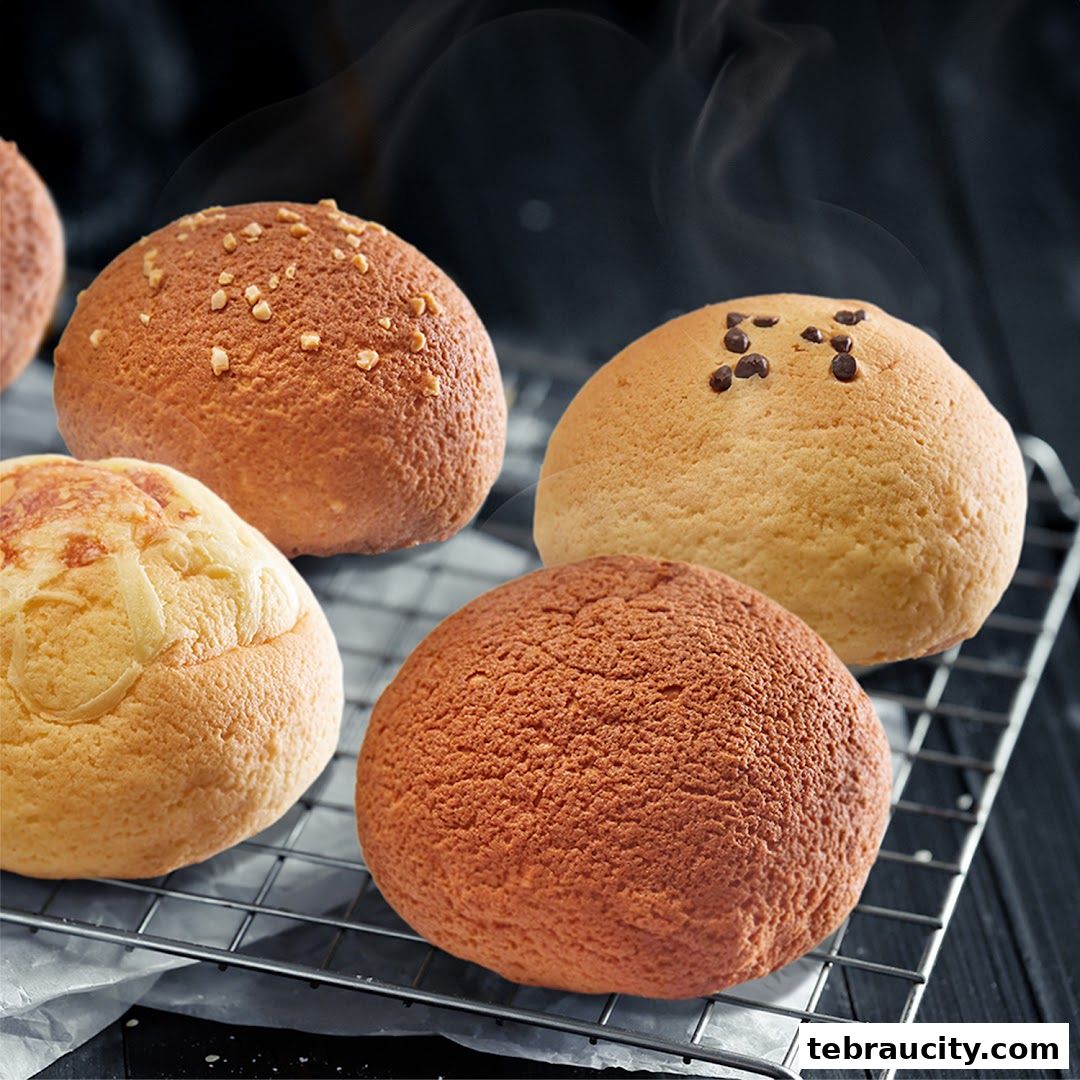 A close-up shot of freshly baked Rotiboy buns with various toppings on a cooling rack.