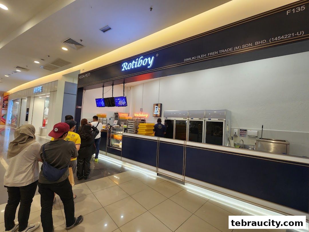 A queue of people waiting outside the Rotiboy bakery in a shopping mall.