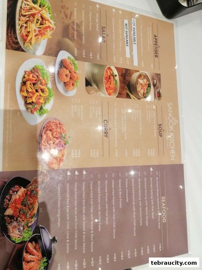 A menu from Sanook Kitchen featuring Thai dishes like seafood, curries, and salads with prices.