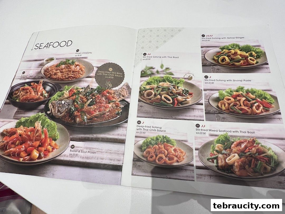 A menu page showcasing various seafood dishes with appetizing images and prices.