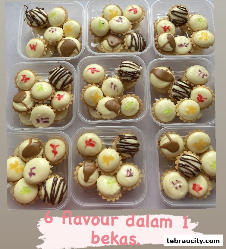 Assortment of mini tarts with white cream filling and various toppings in plastic containers.