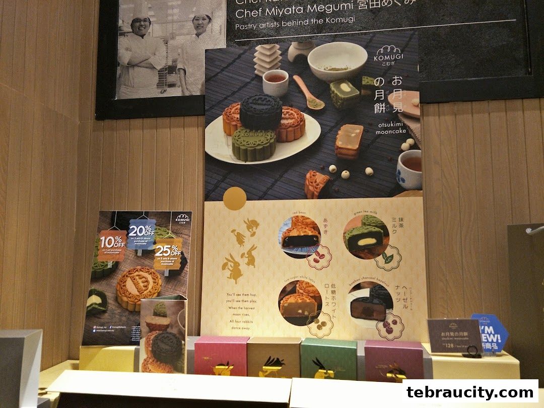 A display of mooncakes and promotional flyers for a bakery.