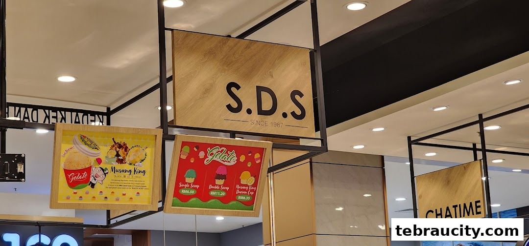 Signs for SDS Gelato, Musang King, and Chatime in a mall.
