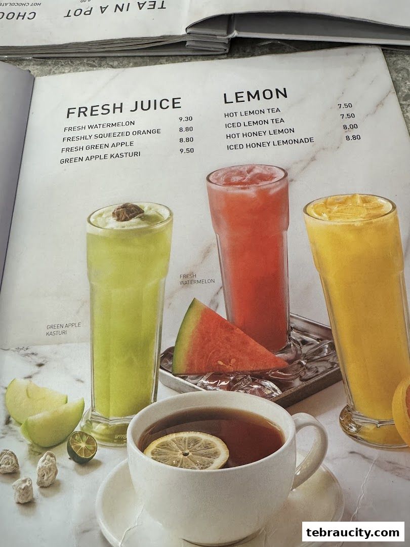 A menu page from Secret Recipe featuring fresh juices and lemon-based drinks with vibrant photos.