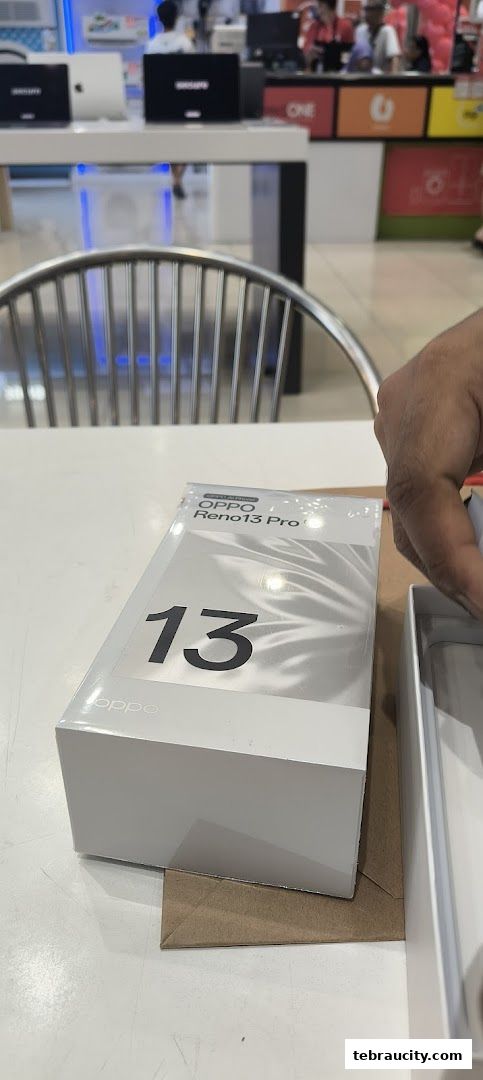 A close-up of an OPPO Reno 13 Pro phone box on a table.