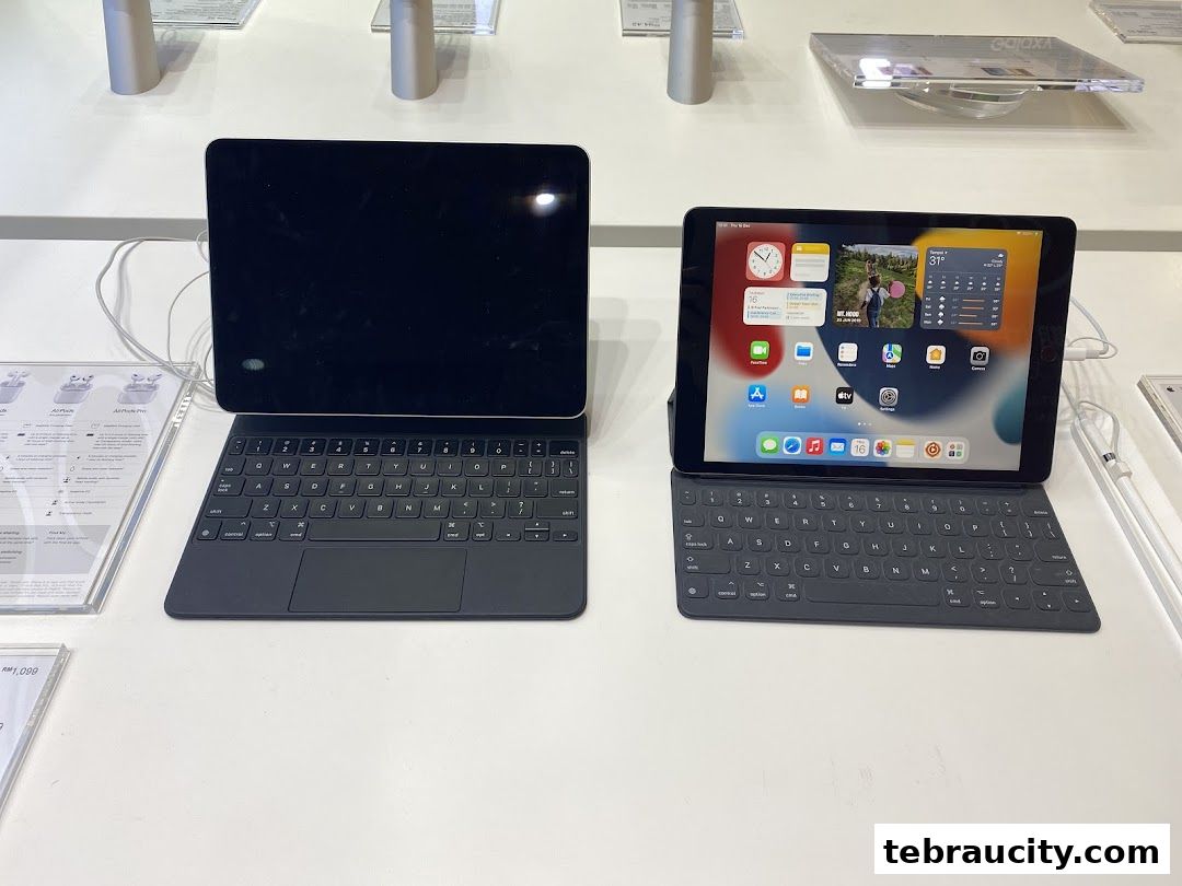 Two tablets with keyboards are displayed on a white surface, showcasing different interfaces.