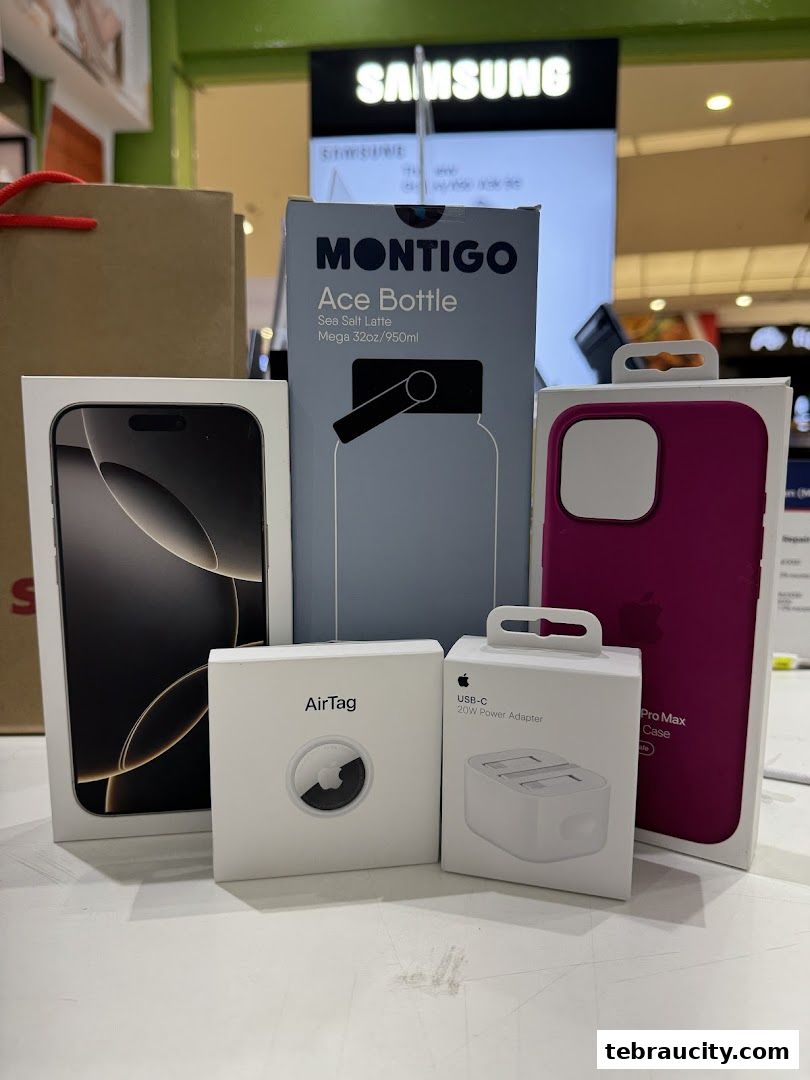 Various Apple accessories and a Montigo bottle are displayed on a table.