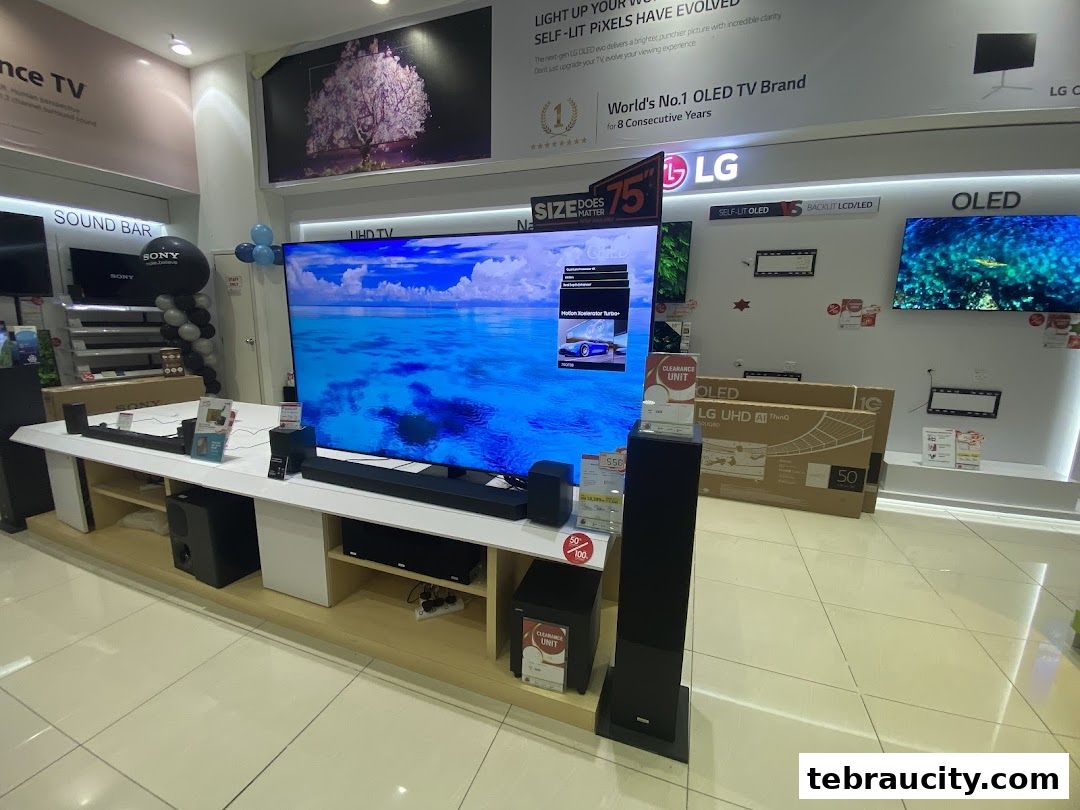 A display of LG OLED televisions and Sony soundbars in a retail electronics store.