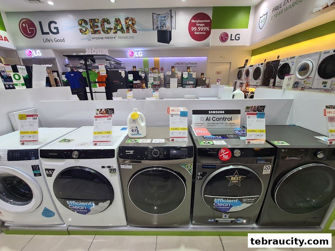 A display of various washing machines from LG, Samsung, and Sharp brands.