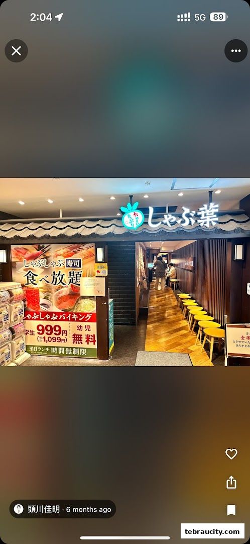The entrance of Shabu-Yo restaurant with a promotional sign for all-you-can-eat shabu-shabu and sushi.