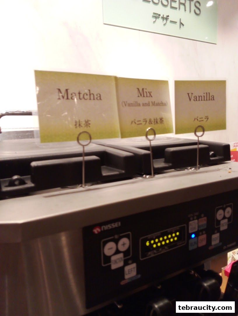 A dessert machine with labels for Matcha, Mix, and Vanilla flavors.