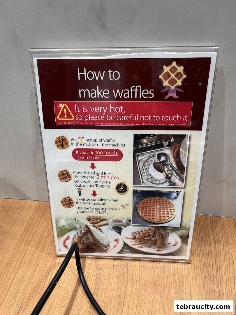 A sign explaining how to make waffles with step-by-step instructions and images.