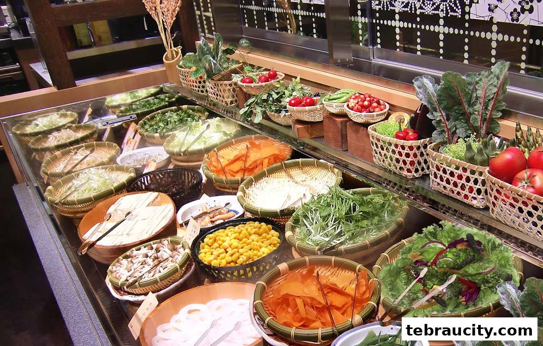 A display of fresh vegetables and ingredients in baskets at a buffet or restaurant.