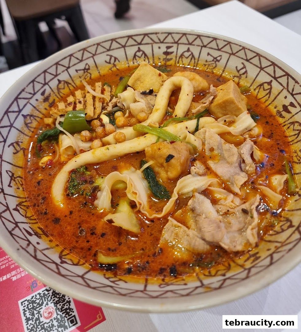 A close-up of a steaming bowl of Mala Tang with various ingredients in a spicy broth.