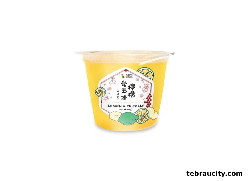 A cup of Shihlin Taiwan Street Snacks Lemon Aiyu Jelly with honey.