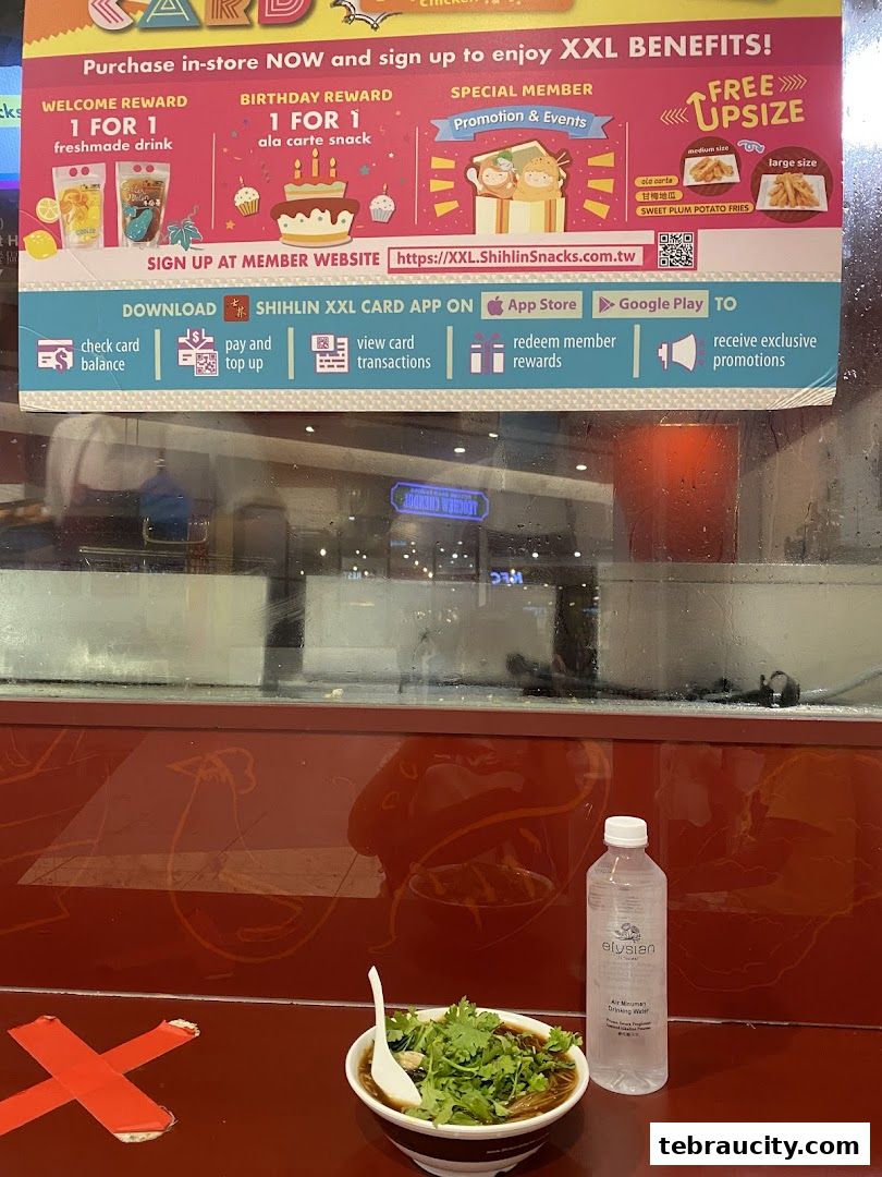 A promotional poster for Shihlin Taiwan Street Snacks' XXL card benefits, with a bowl of food and a water bottle in the foreground.