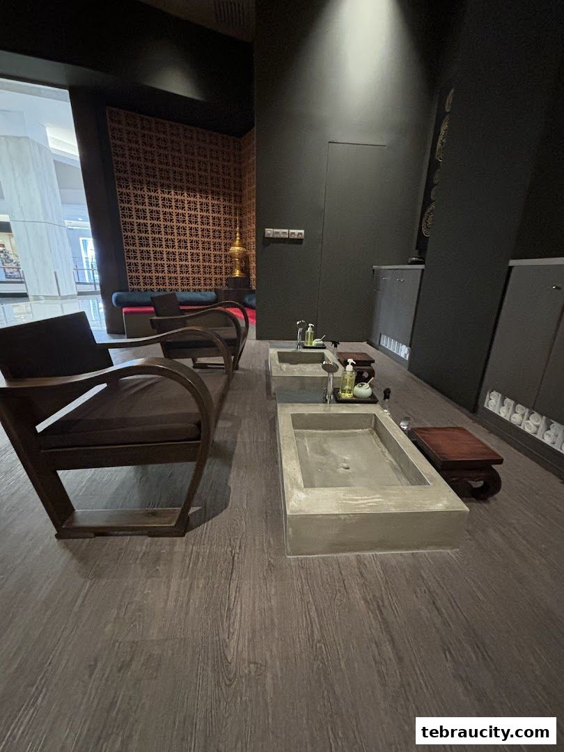 Interior of a spa with foot baths, chairs, and decorative elements.