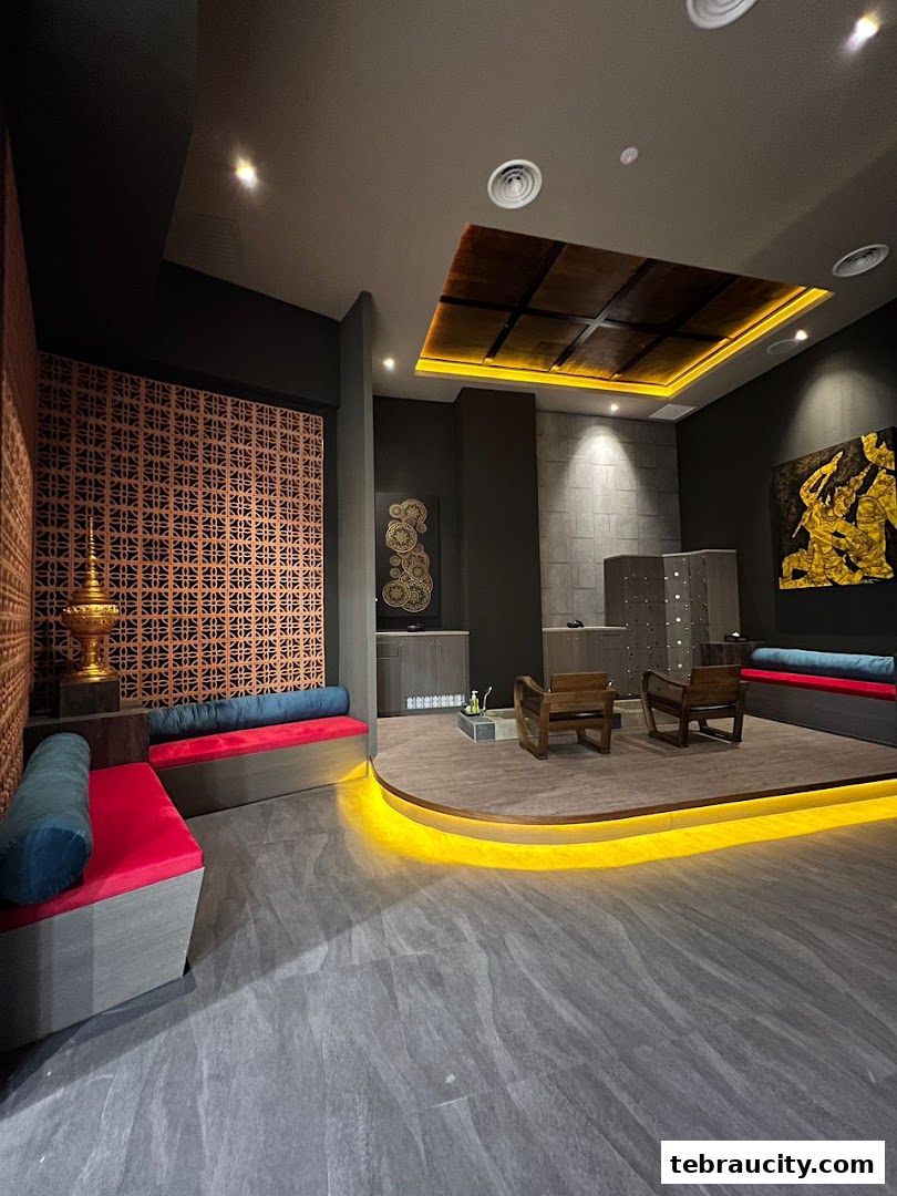 Interior of a spa with seating, lockers, and decorative elements.